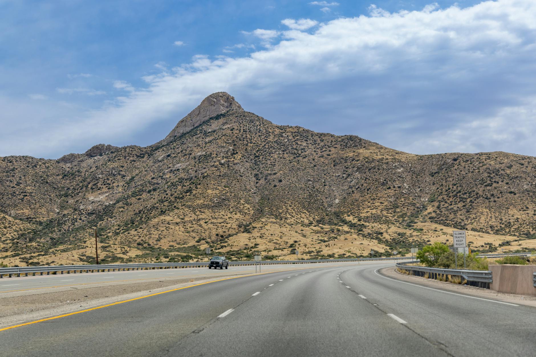 hill over road in countryside